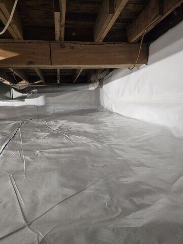 The crawl space is now cleaner, brighter, and better protected from ground moisture.