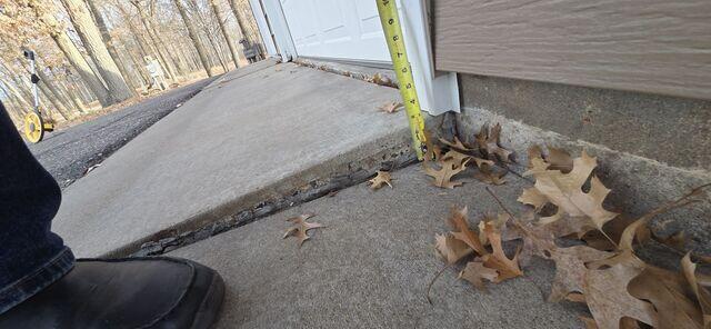 The sunken slab by the driveway