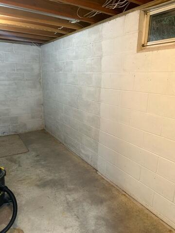 Before: The Design Specialist recommended securing several waterproofing products throughout the basement.