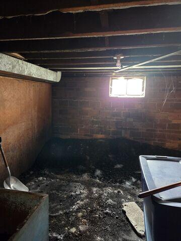 Before: Our Design Specialist, Dylan, recommended waterproofing and stabilizing the entire space.