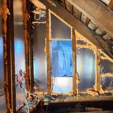 Installing SilverGlo foam boards with a radiant barrier along the adjoining walls helps reflect radiant heat away from the living space, keeping unwanted heat out and creating more comfortable conditions in the conditioned rooms. We also use air-sealing foam to seal all gaps, cracks, and penetrations, helping prevent air leakage and improve overall energy efficiency.