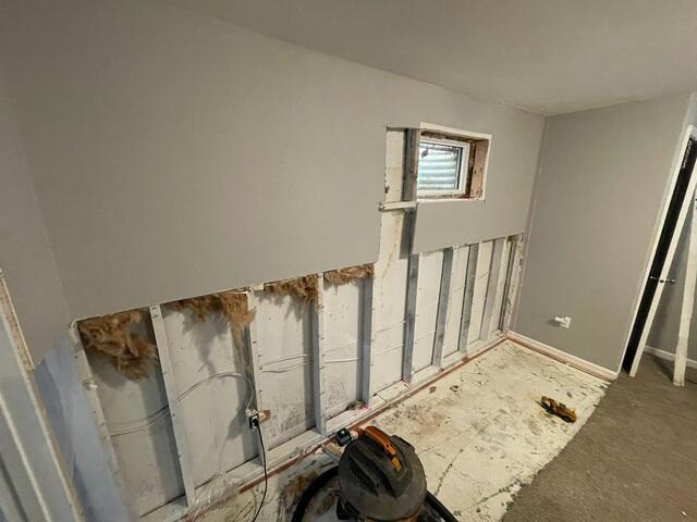 Before: Our Design Specialist, Ian, traveled to the home to evaluate the status of the basement.