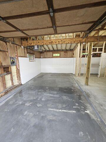 A new concrete slab created a solid and durable surface for parking vehicles, storing equipment, and using the garage as a practical workspace.