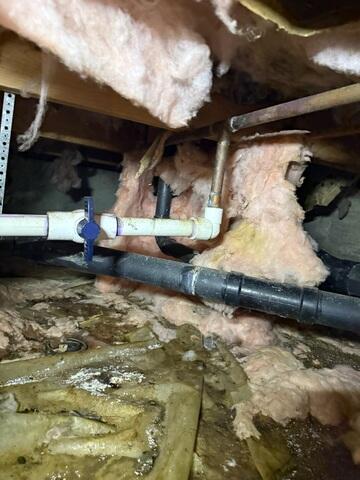 Water accumulates in the crawl space, soaking up through the fiberglass insulation