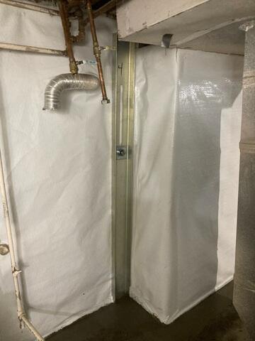 During: Our Foreman, Emmanuel, and his crew worked hard to secure all the products throughout the basement.