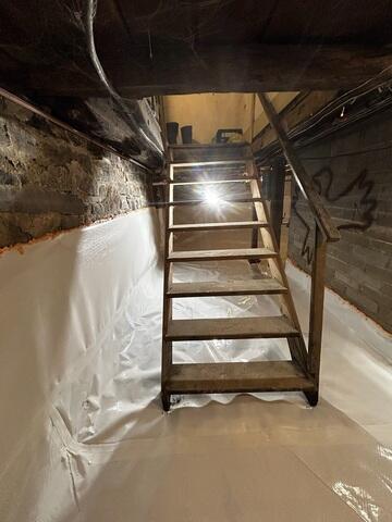 CleanSpace was installed across the basement floor and halfway up the foundation walls. The durable liner provides a clean, bright surface and helps isolate the basement from moisture associated with the older floor and walls.