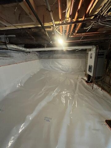 CleanSpace was installed across the basement floor and extended halfway up the foundation walls. The durable liner helps isolate the basement from ground moisture while creating a cleaner and brighter surface.