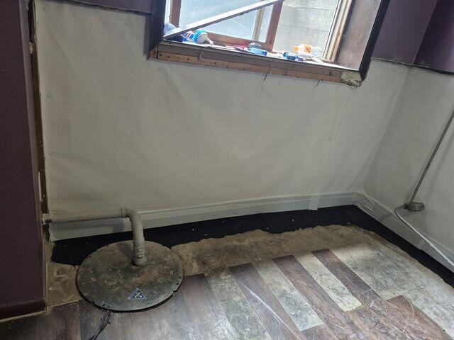 After CleanSpace was attached to the walls, the flooring was restored to cover up WaterGuard