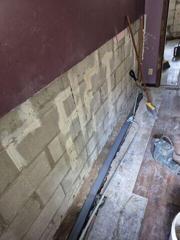 The edges of the floor were drilled and WaterGuard is placed down