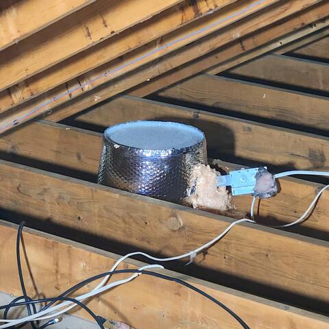 We installed airtight can light covers over the recessed (can) lights and used ZypFoam sealant to seal cracks and gaps around each fixture, preventing conditioned air from escaping into the attic and improving the home's energy efficiency.