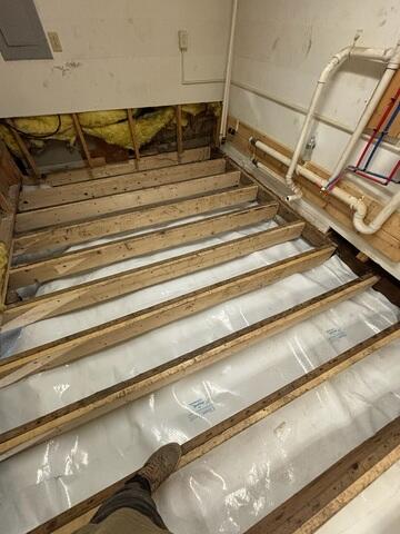 CleanSpace is a durable crawl space liner installed across the ground and secured throughout the crawl space. It separates the home from exposed earth, reduces the movement of ground moisture into the space, and creates a cleaner, brighter environment beneath the home. NuWood uses pressurized sodium bicarbonate to remove mold, staining, and debris from wooden crawl space surfaces. The blasting process reaches the uneven surfaces and tight areas around floor joists, beams, and the underside of the subfloor while restoring a noticeably cleaner appearance to the wood.