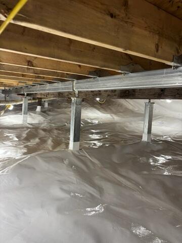 CleanSpace is a durable liner installed across the crawl space floor. It separates the home from the exposed ground, reduces the movement of moisture vapor into the space, and creates a cleaner and brighter area beneath the home.