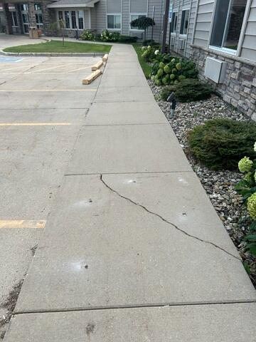 During: Our Foreman, Patrick, and his crew worked hard to lift all the damaged areas of the exterior concrete.