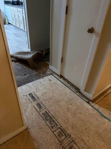 Hallway sub floor replacement. Main beam and sister joist replacement
