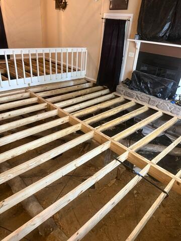 Sub floor replacement in progress. Main beam and sister joist replacement