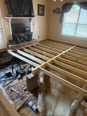 Sub floor replacement in progress. Main beam and sister joist replacement.