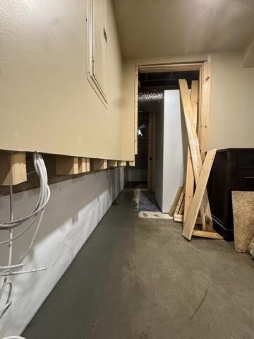 A below-floor interior drainage system is installed around the basement perimeter to capture water and direct it toward the sump pump system. Installed along the foundation walls to intercept wall water and direct it downward into WaterGuard while providing a clean, bright wall surface behind the finished walls.