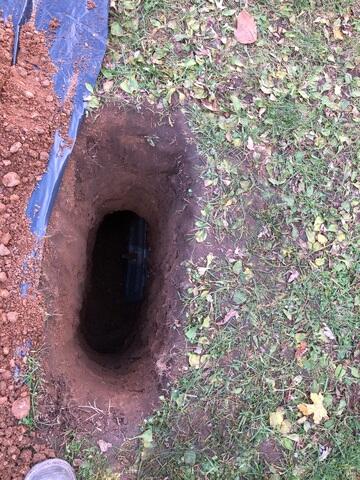 The earth anchors are placed in the holes and connected to the interior wall plates for the GeoLock