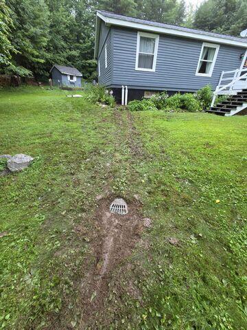 LawnScape™ Outlet - Provides a discreet termination point for the buried discharge line and releases pumped water away from the home's foundation