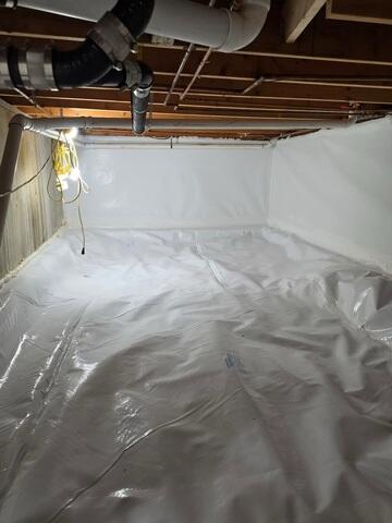 CleanSpace® Crawl Space Encapsulation System - A durable liner designed to isolate the crawl space from the damp ground below. CleanSpace helps reduce ground moisture entering the crawl space while creating a clean, bright, and easier-to-maintain environment beneath the home.

Drainage Matting - A durable, dimpled drainage layer installed beneath CleanSpace. It creates drainage space underneath the encapsulation system while providing additional durability and support for the liner.