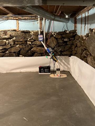 CleanSpace® Wall System - Installed along the lower portion of the stone foundation walls to manage wall moisture and direct it downward into the basement drainage system. TripleSafe® Sump Pump System - Provides three levels of sump pump protection, including primary pumping capacity, additional pumping protection during high-water conditions, and battery-backup protection during power outages. SmartJack® XT Support System - Heavy-duty, adjustable steel supports used to replace inadequate basement columns and provide dependable support for the beams and floor structure above.