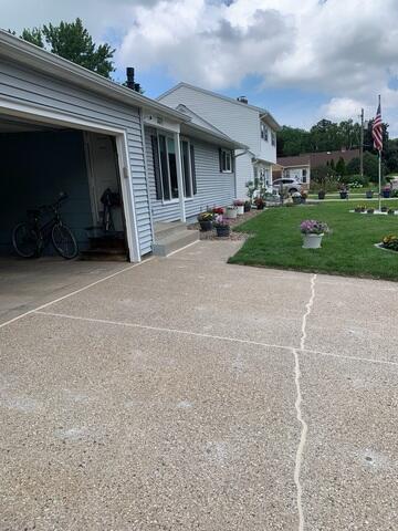 After our crew lifted and leveled the driveway and walkway and sealed the joints and cracks