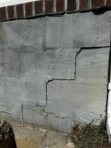 Wall cracks due to a sinking foundation.