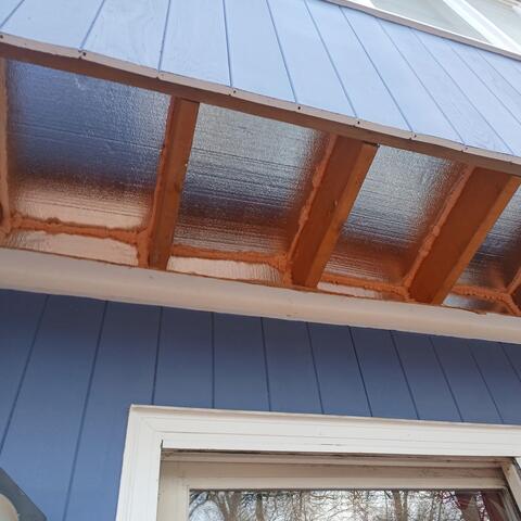 We installed 4-inch-thick SilverGlo rigid foam board with a radiant barrier, blocking each joist bay and sealing the blocks with expanding foam. SilverGlo was also installed against the underside of the floor deck and thoroughly sealed with expanding foam to help prevent air infiltration and improve insulation.