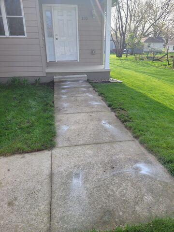 During: The crew succesfully lifted the damaged and sinking sidewalk back to its original level.