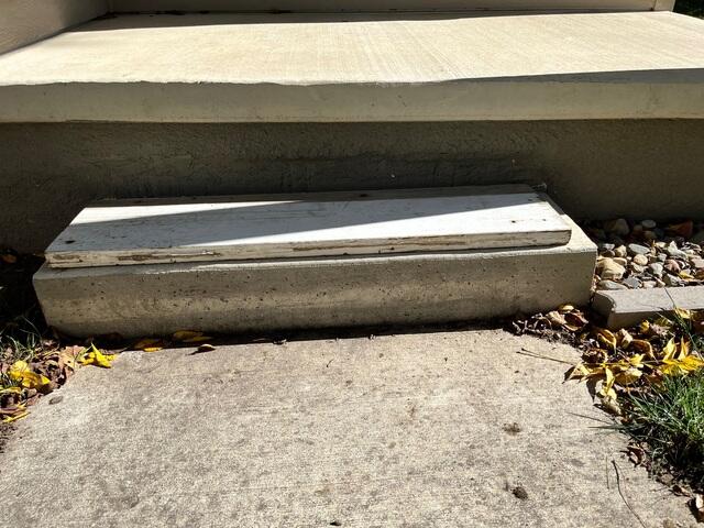 Before: The Design Specialist recommended lifting and leveling the steps back to its original level.
