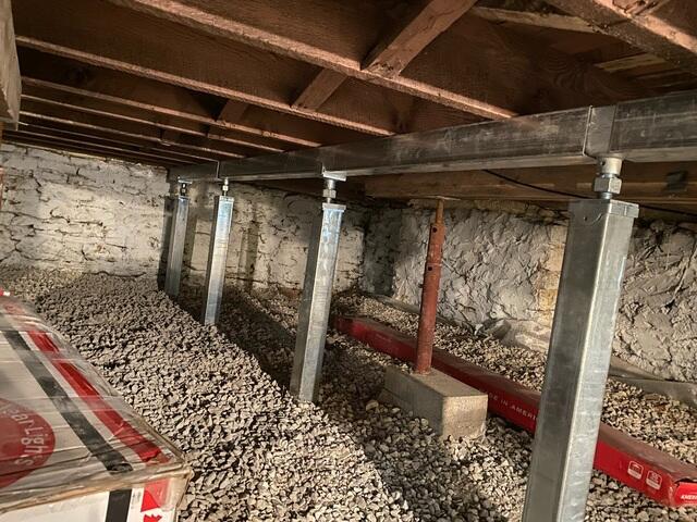 Once the concrete cures, the crew installs the SmartJacks and supplemental beam.