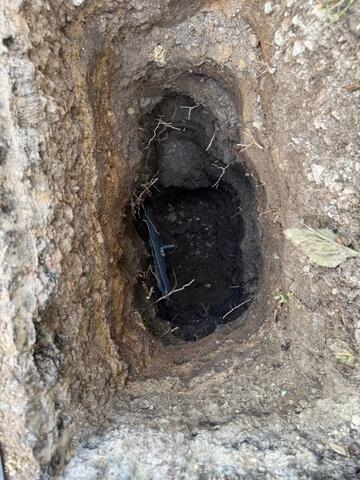 The crew placed the earth anchor and connected it to the interior wall using a small steel pole that runs through the ground