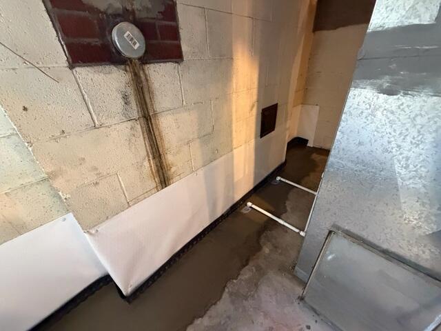The crew installed a CleanSpace wall vapor barrier to further help reduce moisture and wall leaks. They finished by re-concreting the floor.