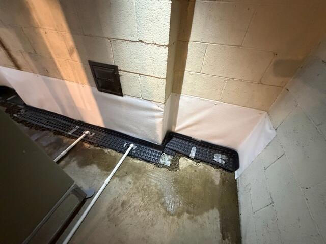 Our crew was able to install the WaterGuard drainage system around the basement perimeter, integrating the condensate lines with the system.