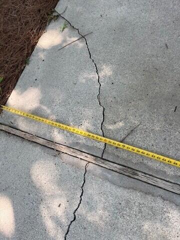 Measuring the unlevel pieces of concrete in the middle of an expansion point. A design specialist conducted a free inspection and provided the home owner with a estimate for solutions.