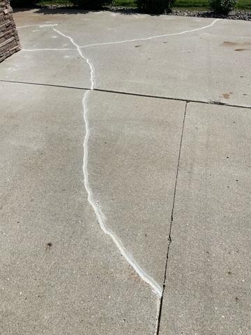 During: Our Foreman, Charlie, and his crew worked hard to lift and level the damaged slabs.