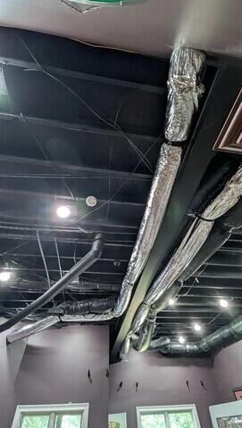 Our technicians ran the ERV ducts alongside existing ductwork in the basement ceiling, where it could be hidden by a drop ceiling in the future if the homeowner elects to do so.
