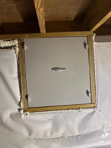 Our team installed a custom-built access door to seal the opening in the interior crawl space wall. The door was sized specifically for this opening and secured within a framed surround, helping maintain the encapsulated environment while still allowing access to the area behind the wall.