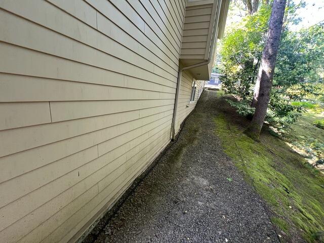 This foundation wall was located in a high water accumulation area. In order to protect the wall and the stability of the home, our crew readied to install a drain system parallel to the wall, to prevent ground water from reaching the home.