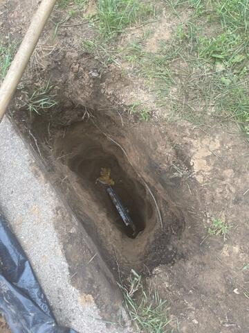 After digging the holes, the earth anchor is placed to connect to the interior wall