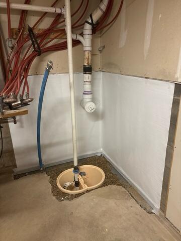 CleanSpace was attached to the walls, WaterGuard added along the perimeter of the floor, and components of SuperSump+ was installed