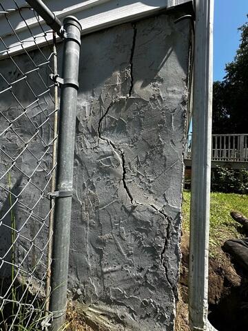 Exterior wall foundation damage.