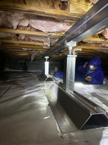 SmartJacks are adjustable steel columns that lift and stabilize sagging floors.