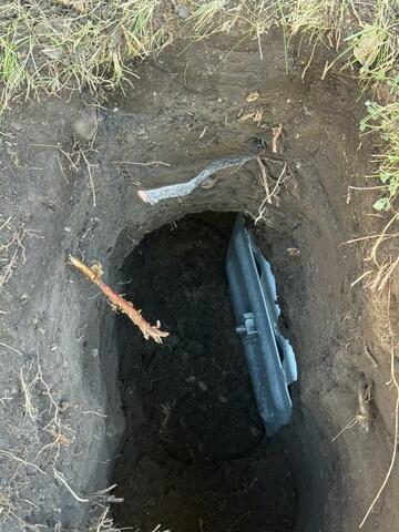 The earth anchor is placed and connected to the interior wall plate using a small steel pole which runs through the ground