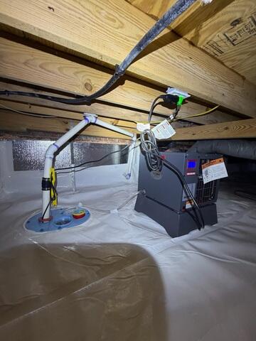 SmartSump is a mechanism that pumps water out of the crawlspace through pipes to a discharge area.
