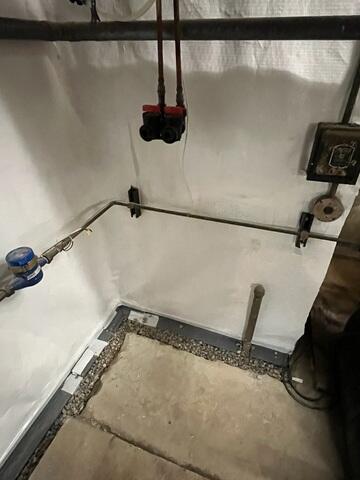 During: Our Foreman, Aaron, and his crew worked hard to secure all the waterproofing products throughout the basement.