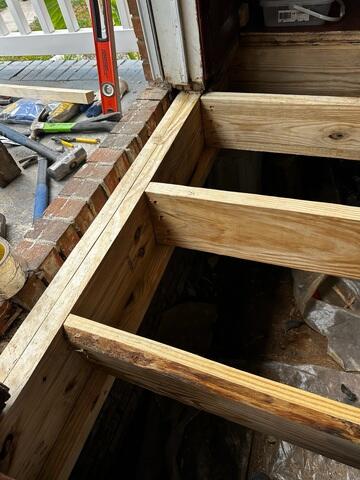 We removed the old rotten sister joists and replaced them with new wood.