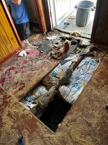 The deteriorating plywood and subfloor before we fixed it.