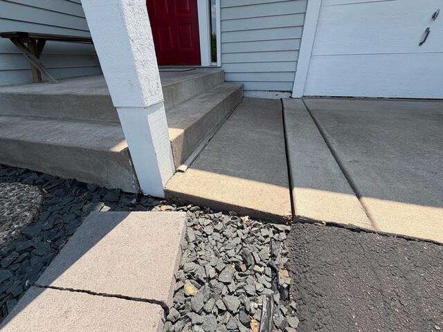 The slabs in front of the steps began sloping
