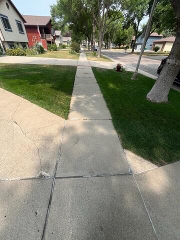 Before: Our Design Specialist, Ian, recommended lifting and leveling the damaged and sinking concrete around the home.